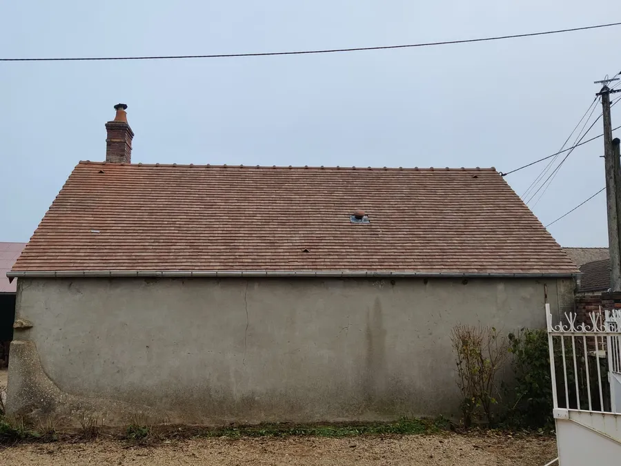 Toiture en tuile plate terre cuite posée après réfection